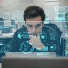 En ung data scientist analyserar komplexa dataflöden på en futuristisk skärm.