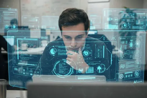 En ung data scientist analyserar komplexa dataflöden på en futuristisk skärm.