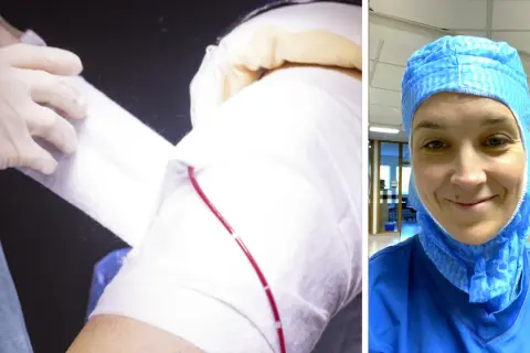 En person i blå operationskläder och skyddshuva ler mot kameran. Till vänster syns en arm som bandageras, en del av en ortoped utbildning.
